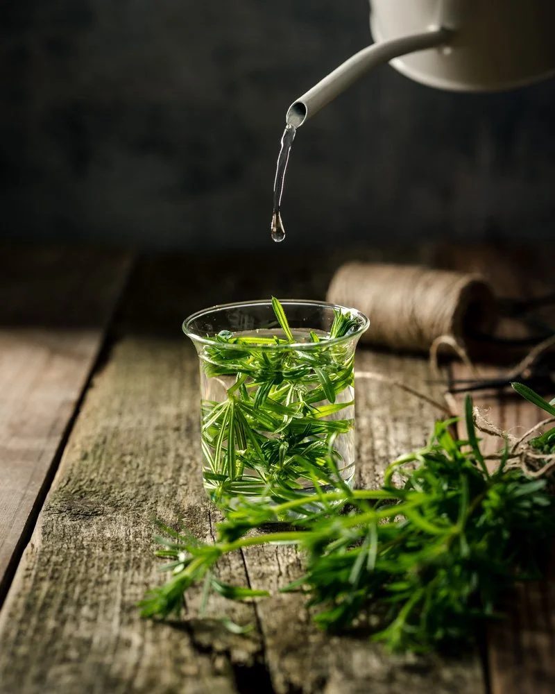 Botanical extract being prepared in a small glass